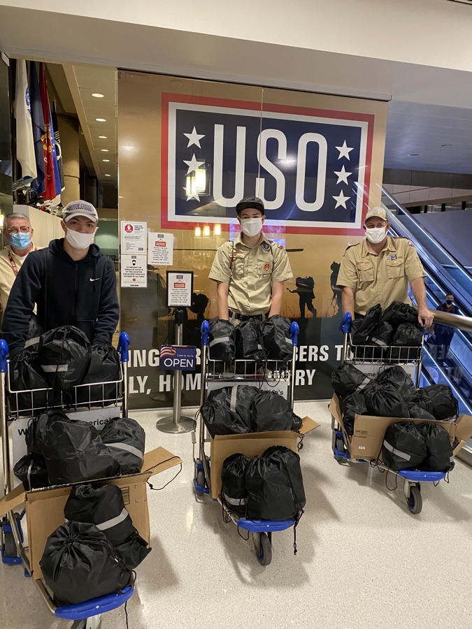 Delivering care packages with Scouts at the USO